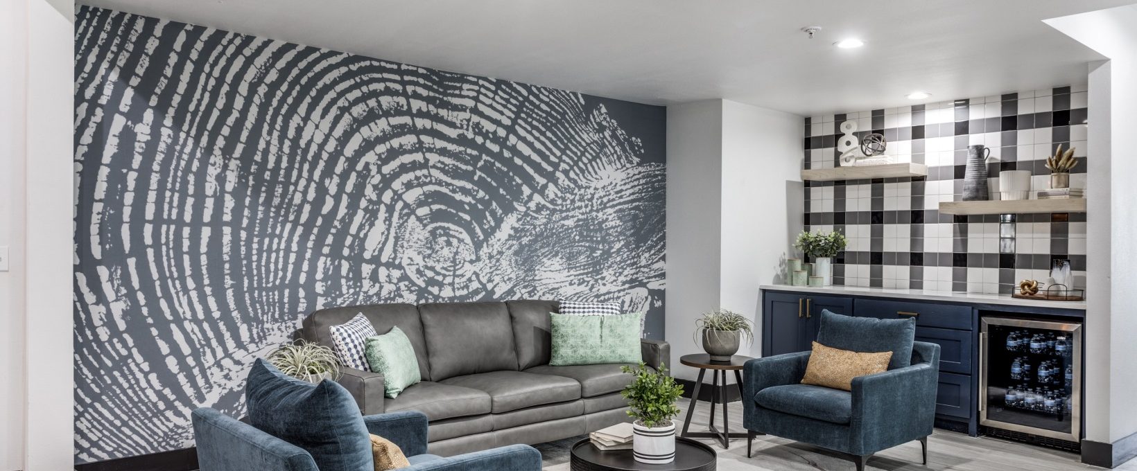 the living room features a large wall mural at The Ellwood at Lake Travis