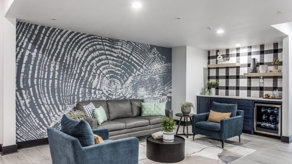the living room features a large wall mural at The Ellwood at Lake Travis